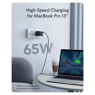 Complete UK Nano II 65W charger connected to a laptop