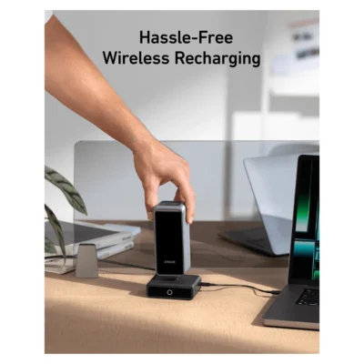 Anker Prime Power Bank 27,650mAh 250W with 100W Charging Base — complete bank being placed onto charging base