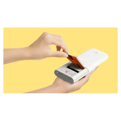 Whole Mi Portable Photo Printer with its sliding cover open for paper loading