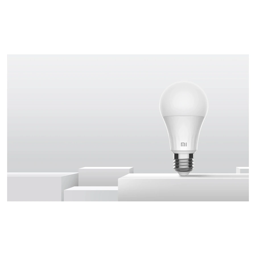 Whole Mi Smart LED Bulb Warm White displayed on a white pedestal