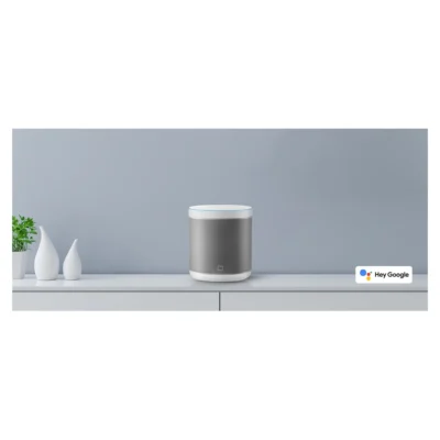 Whole White Mi Smart Speaker displayed on a table