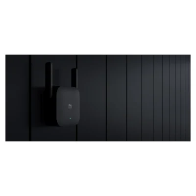 Whole Mi Wi-Fi Range Extender Pro plugged into a wall outlet