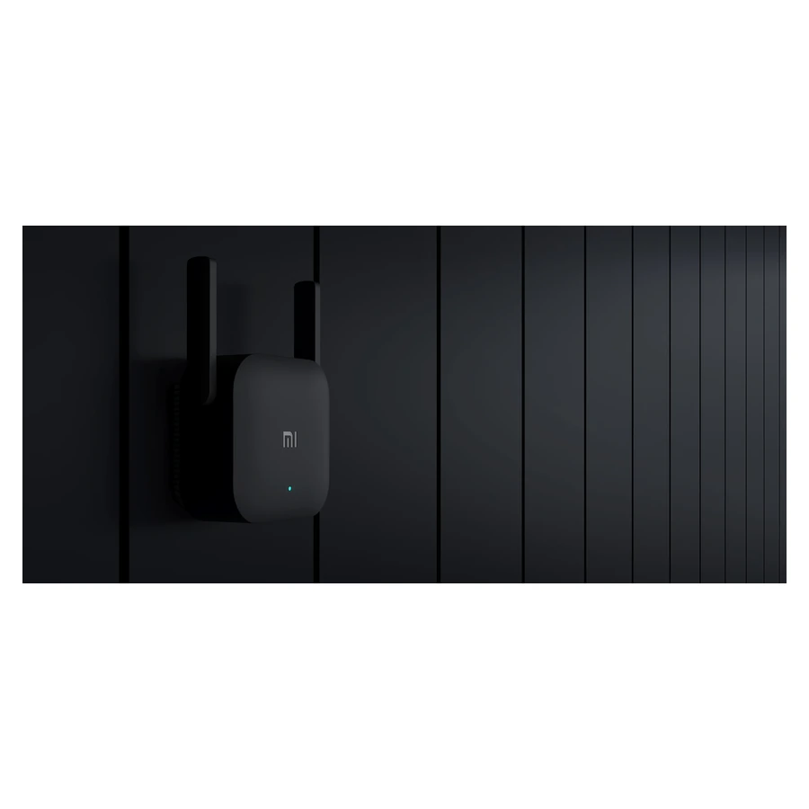 Whole Mi Wi-Fi Range Extender Pro plugged into a wall outlet