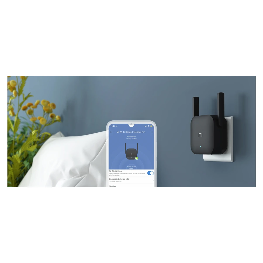 Complete wall-mounted Mi Wi-Fi Range Extender Pro beside Xiaomi Home setup on a phone