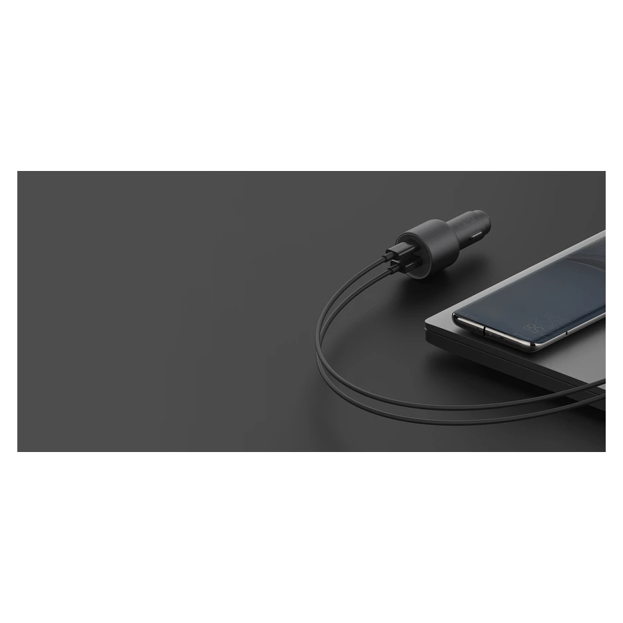 Whole Xiaomi 67W Car Charger connected by cable beside a tablet