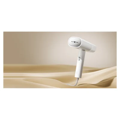 Xiaomi Handheld Garment Steamer — complete steamer resting on fabric