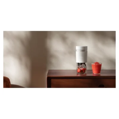 Xiaomi Portable Blender — complete blender beside a prepared fruit drink