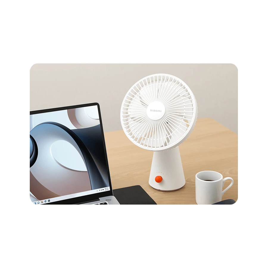 Xiaomi Rechargeable Mini Fan — complete fan beside a laptop