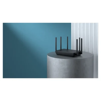 Whole Xiaomi Router AX3200 on a pedestal beside a curtain