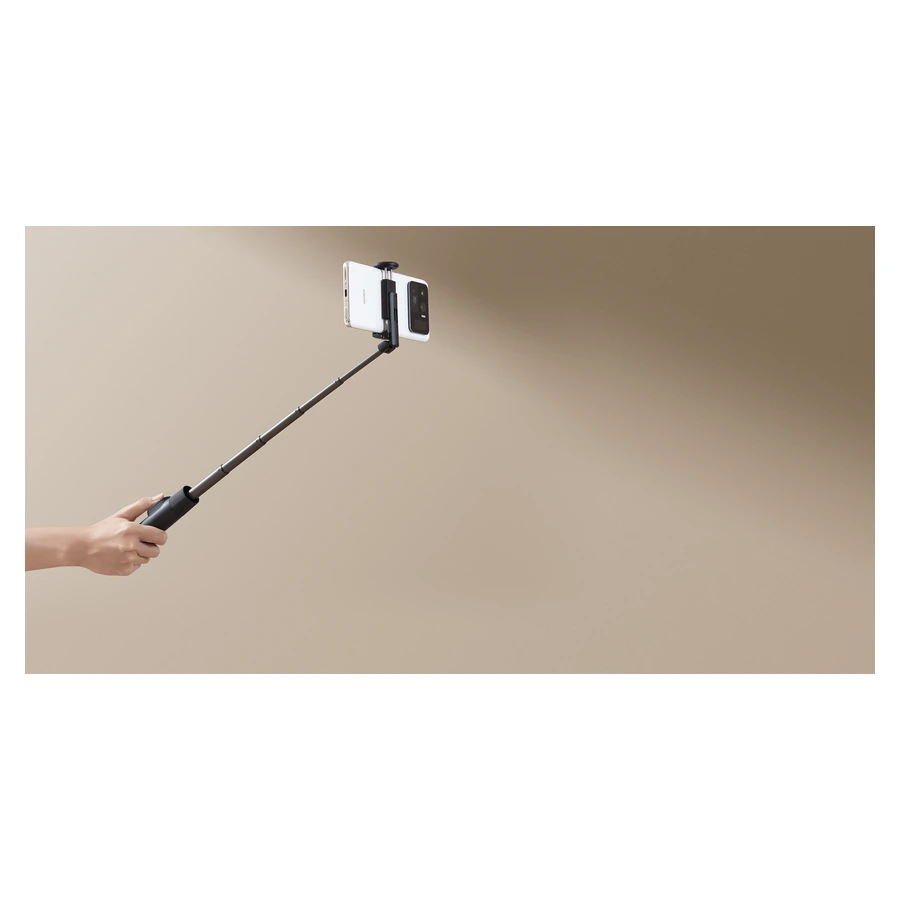 Xiaomi Selfie Stick Tripod Mini — complete extended stick used for a phone photograph