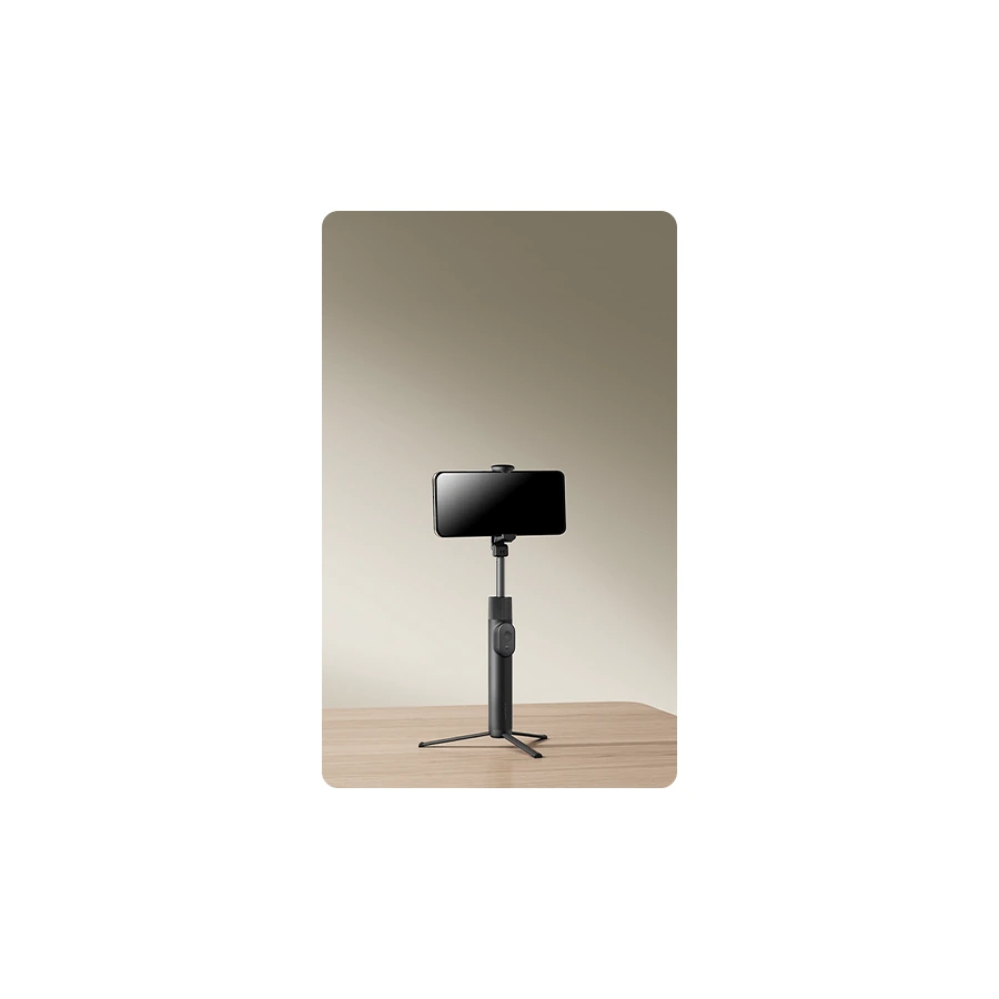 Xiaomi Selfie Stick Tripod Mini — complete tripod holding a phone in landscape orientation